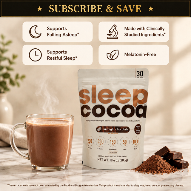 SleepCocoa melatonin-free nightly cocoa pouch on a marble counter beside a steaming mug of hot cocoa. Subscribe and save.